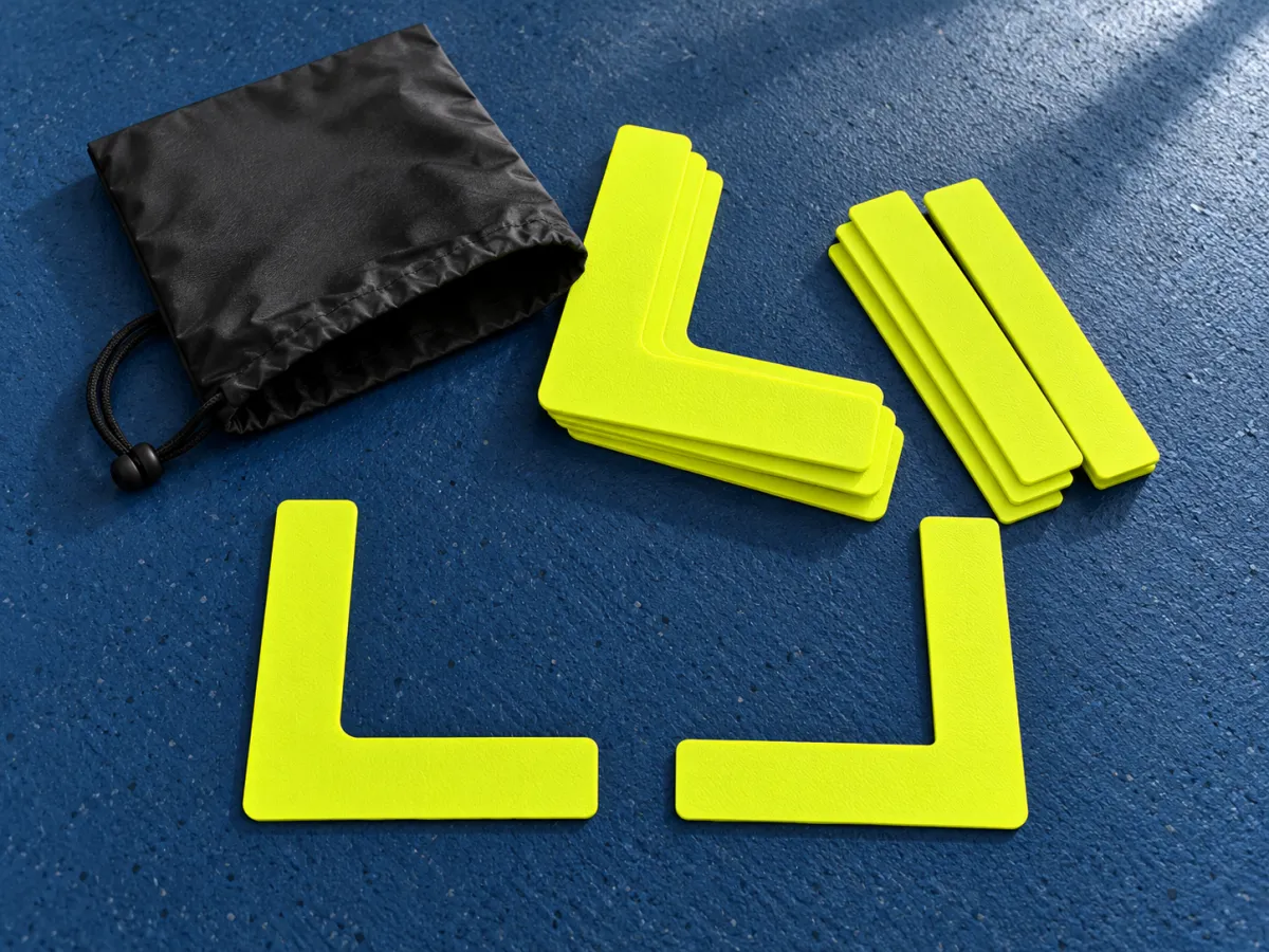 Bright yellow temporary line and corner markers beside a black carry pouch